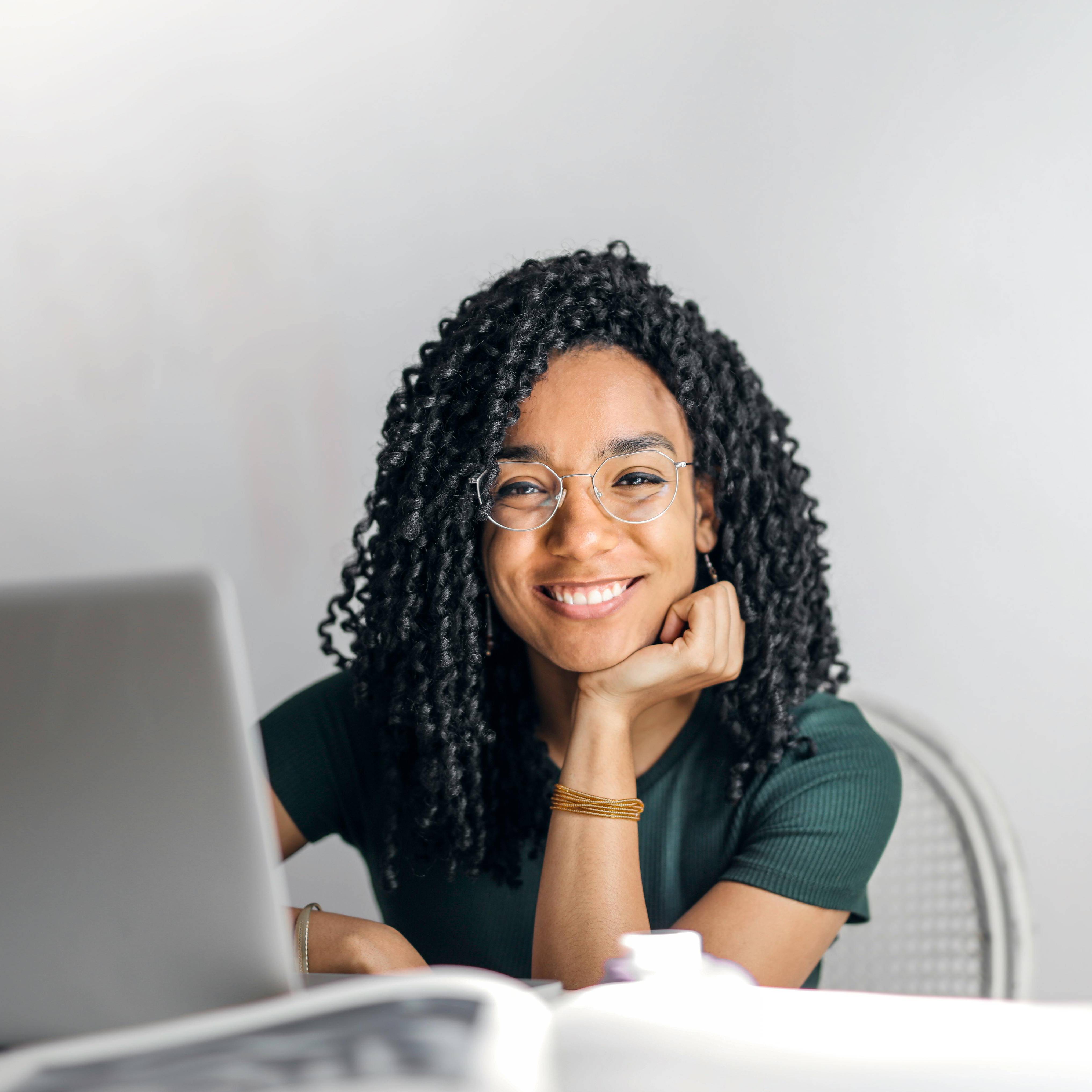 smiling woman on her laptop